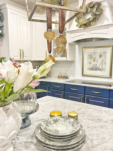 Elegant blue and white kitchen design with marble countertops — Cosmopolitan Interiors
